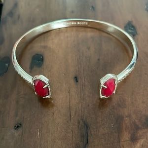 Kendra Scott gold cuff bracelet with red / garnet stone